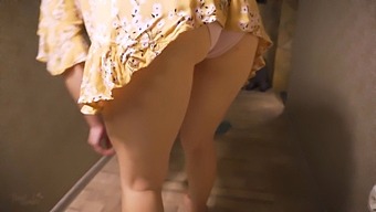 A Milf Flaunts Her Upskirt In The Living Room